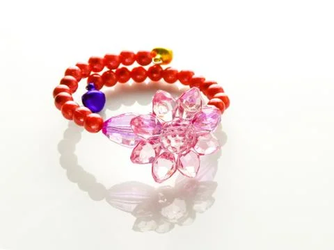 Multi-colored bracelets with beads. Colourful child's bead bracelet.. Stock Photos