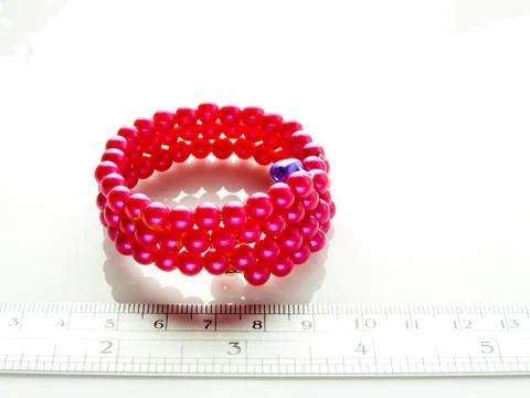 Multi-colored bracelets with beads. Colourful child's bead bracelet.. Stock Photos