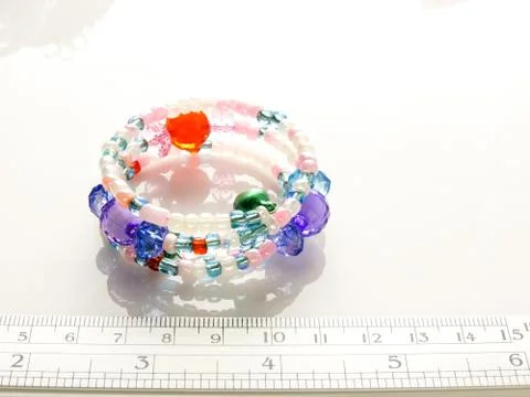 Multi-colored bracelets with beads. Colourful child's bead bracelet.. Stock Photos