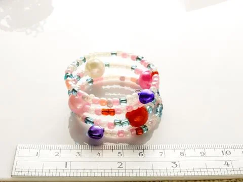 Multi-colored bracelets with beads. Colourful child's bead bracelet.. Foto stock