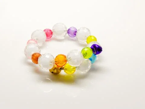 Multi-colored bracelets with beads. Colourful child's bead bracelet.. Stock Photos