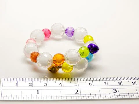 Multi-colored bracelets with beads. Colourful child's bead bracelet.. Stock Photos