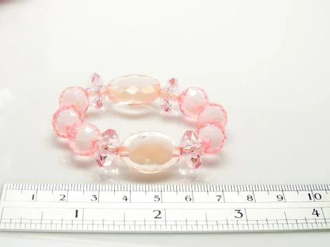 Multi-colored bracelets with beads. Colourful child's bead bracelet.. Stock Photos