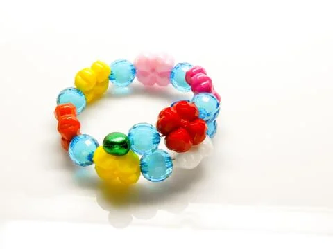 Multi-colored bracelets with beads. Colourful child's bead bracelet.. Stock Photos
