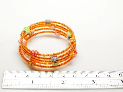 Multi-colored bracelets with beads. Colourful child's bead bracelet.. Stock Photos