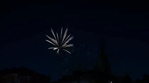 Multi-colored bright fireworks sparks gold and blue colors on the dark sky .. Stock Footage 284867219