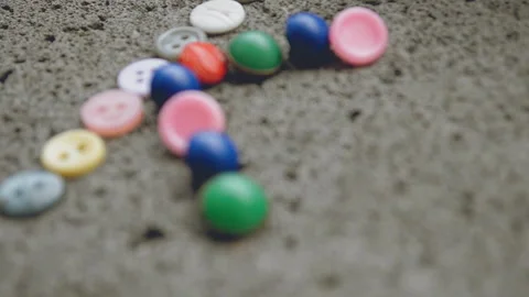 Multi-colored buttons lie Stock Footage 93525023