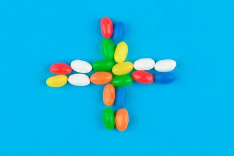 Multi colored candies on a blue background. Tasty colorful candies on blue ba Foto stock