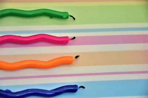 Multi-colored candles Stock Photos