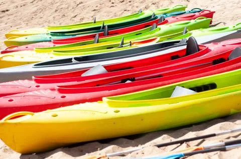 Multi-colored canoes on the sand Foto stock