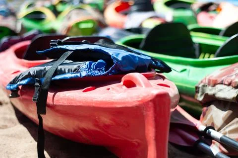 Multi-colored canoes on the sand Stock Photos