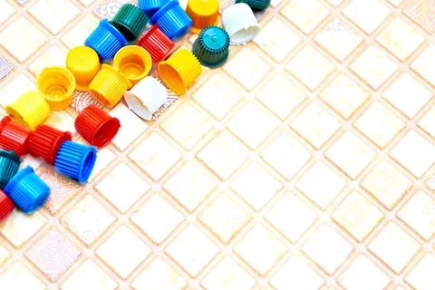 Multi colored caps lids for ketchup, mayonnaise, mustard, sauces Stock Photos