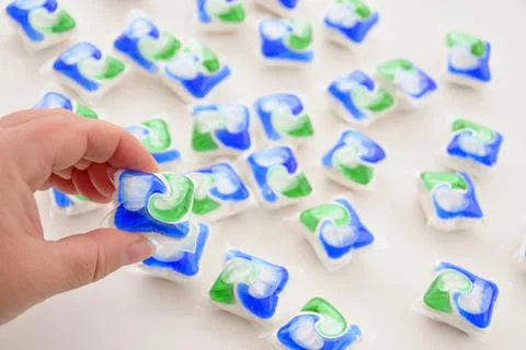 Multi-colored capsules with detergent Stock Photos