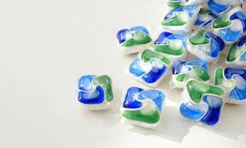 Multi-colored capsules for dishwashers. Stock Photos