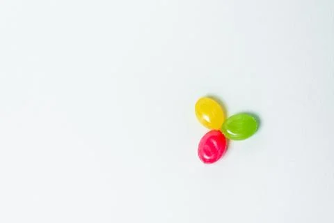 Multi-colored caramel on a white background Stock Photos