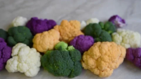 Multi colored cauliflowers on the table Stock Footage 224135141