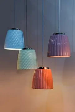 Multi-colored ceramic pendant lights, chandeliers of different colors but of  Stock Photos