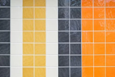 Multi-colored ceramic small square tiles lined with vertical stripes Stock Photos