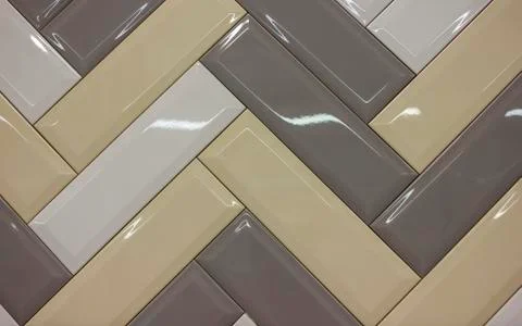 Multi-colored ceramic tiles laid in blocks like parquet Stock Photos