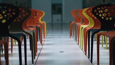Multi colored chairs standing in modern conference room in business office Stock Footage 82185607