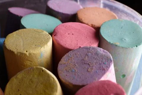 Multi-colored chalk closeup. Children's creativity, entertainment concept. Stock Photos