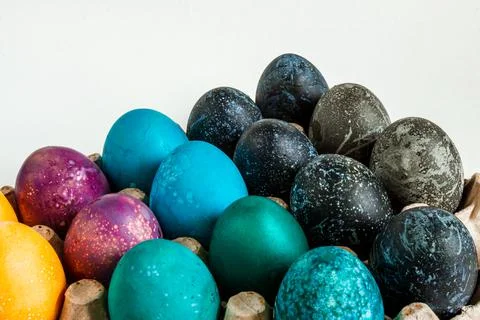 Multi-colored chicken eggs. Feast of Light Easter. Background. Stock Photos
