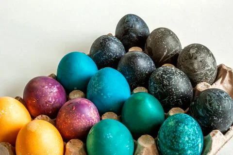 Multi-colored chicken eggs. Feast of Light Easter. Background. Stock Photos
