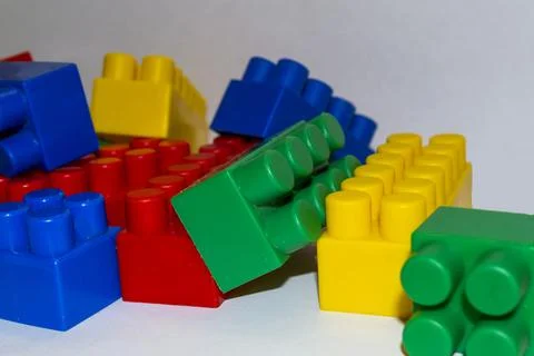 A multi-colored children's designer is lying on a white light table Stock Photos