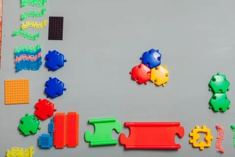Multi-colored children's developing game designer on a gray background Stockfoto's