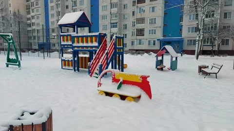 A multi-colored childrens playground with a childrens house and a slide for Stock Footage 295605113