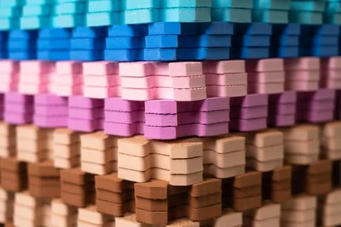 Multi-colored children's rugs in a stack. Foam floor covering in the form of  Stock Photos