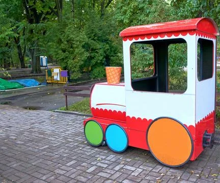 Multi colored children's train for children to ride in a summer amusement park Stock Photos