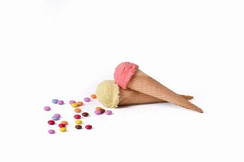 Multi-colored chocolate buttons with ice cream cones Stock Photos