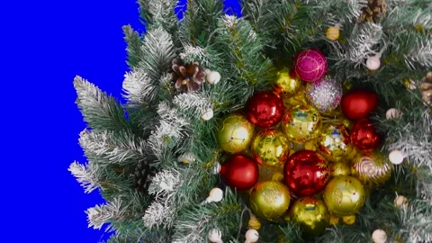 Multi-colored Christmas balls among Christmas tree branches with cones Video stock 194683318