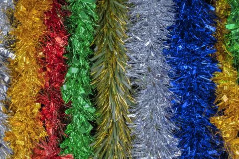 Multi colored christmas tinsel background or texture Stock Photos