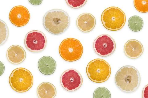 Multi-colored citrus slices on a white background Foto stock