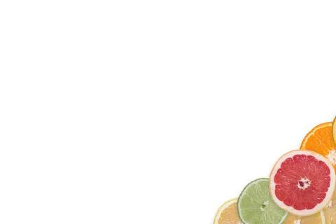 Multi-colored citrus slices on a white background Stock Photos