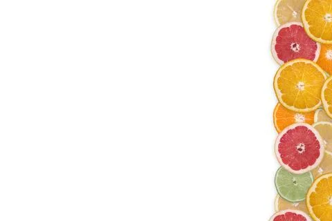 Multi-colored citrus slices on a white background Stock Photos