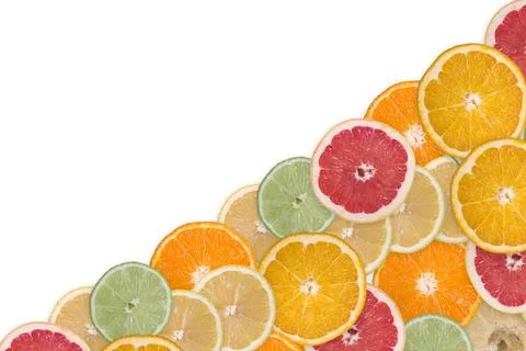 Multi-colored citrus slices on a white background Stock Photos