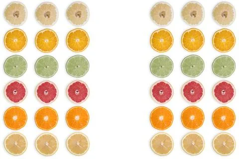 Multi-colored citrus slices on a white background Stock Photos