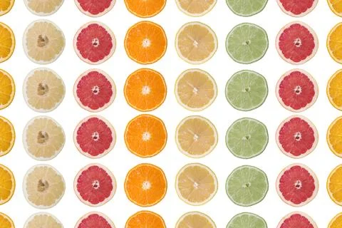 Multi-colored citrus slices on a white background 写真素材