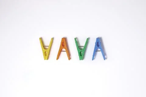 Multi-colored clothespins on a light background. Stock Photos