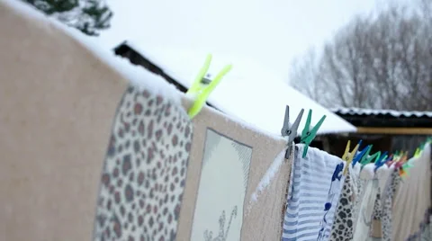 Multi-colored clothespins on rope Stock Footage 58907237