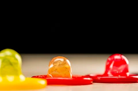 Multi colored condoms Stock Photos