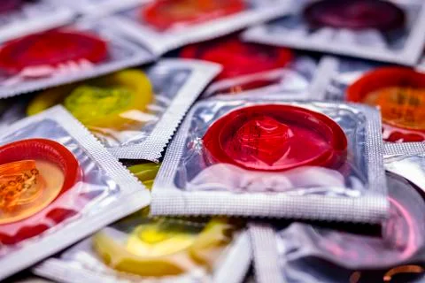 Multi colored condoms Stock Photos