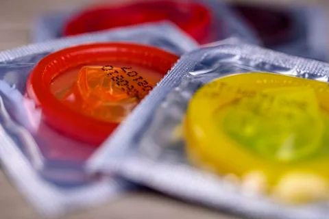 Multi colored condoms Stock Photos