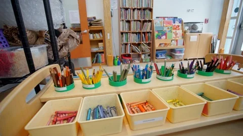 Multi colored crayons in cups and bins Stock Footage 87890272