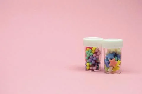 Multi-colored creative elements in the shape of stars and flowers fill tran.. Stock Photos