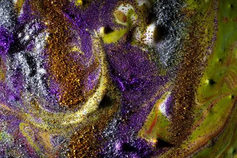 Multi-colored dark background sprinkled with purple and gold sparkles with st Stock-Fotos