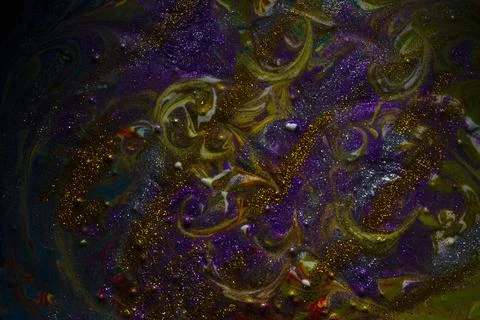 Multi-colored dark background sprinkled with purple and gold sparkles. Contem Stock Photos